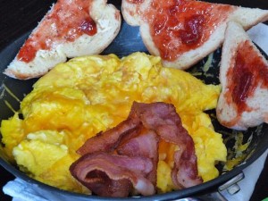 Cheesy Scrambled Eggs with Bacon and Toast